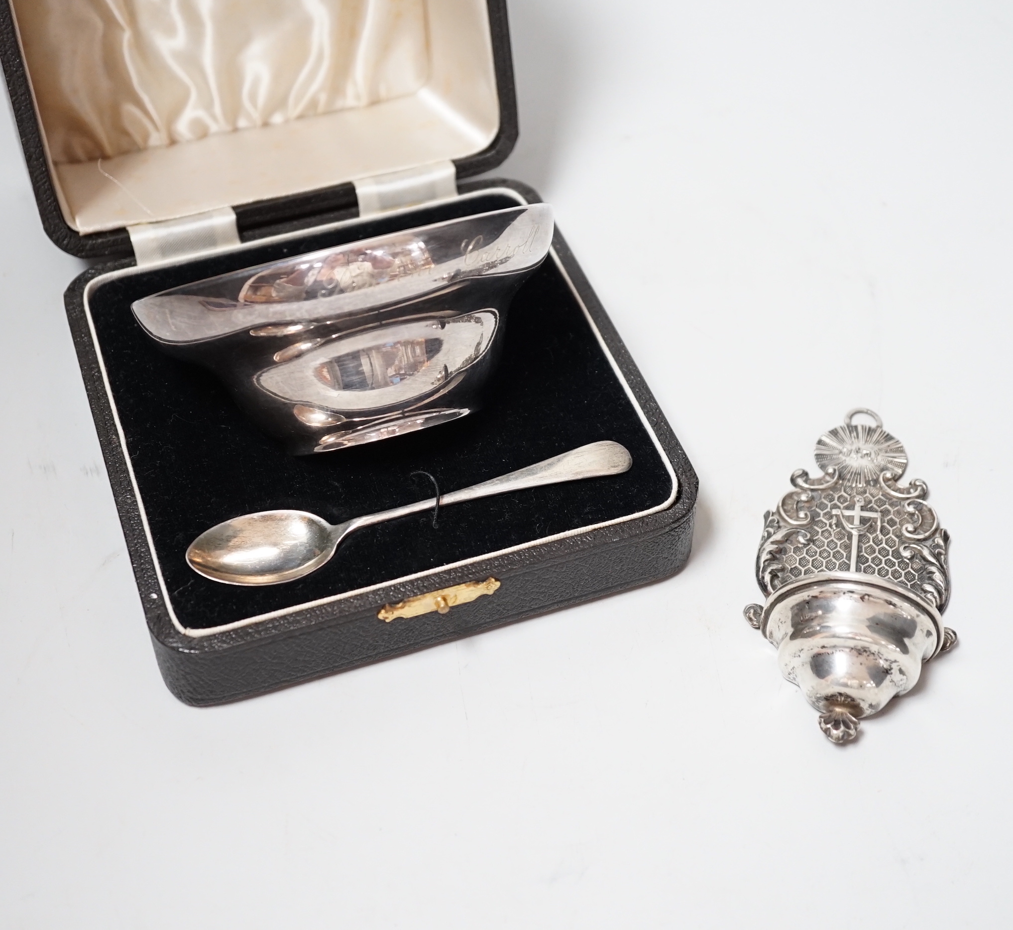 An early 19th century Viennese repousse white metal holy water stoup, 11.4cm, together with a cased 1930's silver spoon and mounted silver bowl.